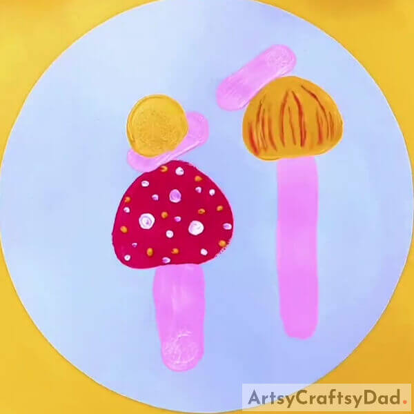 Making The Shells Of The Snails- A tutorial for little ones to make a Mushroom Garden painting with stamps.