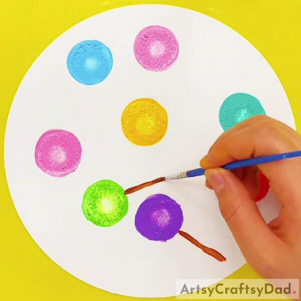 Making The Sticks Of Lollipops- Follow this guide to make a colorful lollipop stamp painting and drawing 