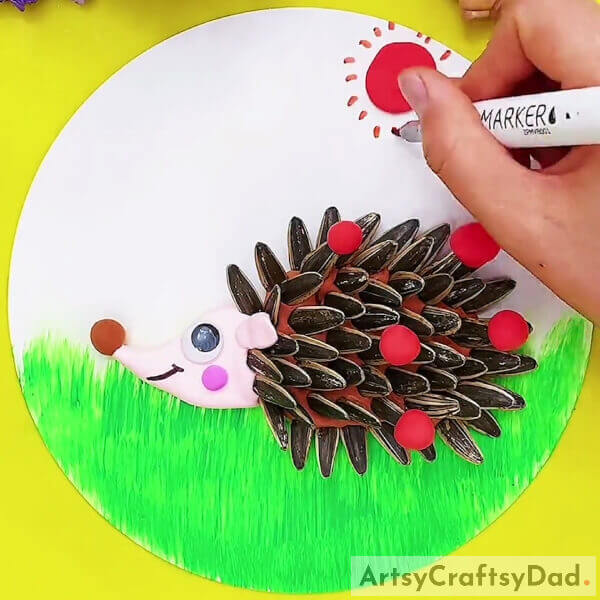 Making The Sun Rays- How to Make a Hedgehog Out of Sunflower Seeds and Clay