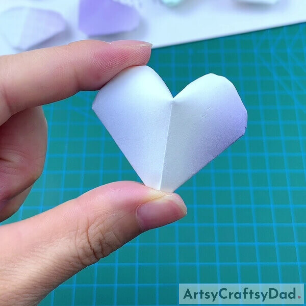 Our Cute Origami Paper Heart Is Ready!- Simple instructions on making a paper heart origami for kids