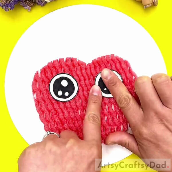 Pasting Eyes On The Apple-Lovely Apple Fun Craft Using Fruit Foam Net For Kids