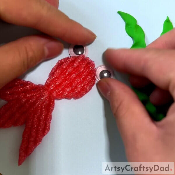 Pasting Googly Eyes- Exploring the Marine World: A Tutorial on Making Fruit Foam Nets & Clay Crafts