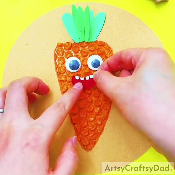 Pasting Mouth Of Your Carrot- Crafting with Bubble Wrap and Carrots for Children