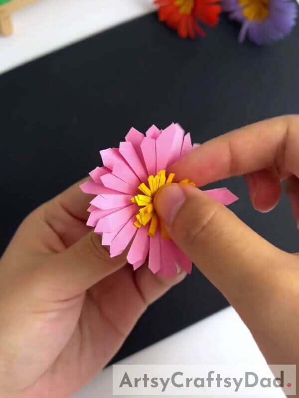 Pasting Pollen In The Middle Of Our Flower- Instructions to make Paper Flowers with a Cutter