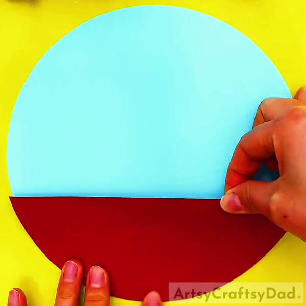 Pasting Red Color Craft Paper On Light Blue Color Craft Paper- A Guide to Making Winter Cherry Blossom Art