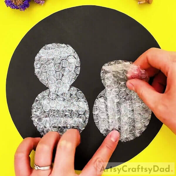 Pasting Snowmen Cutouts- Colorful Snowman Painting Craft Using Bubble Wrap Tutorial For Kids