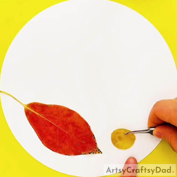 Pasting The Cut Circle- How to construct a leafy caterpillar scene