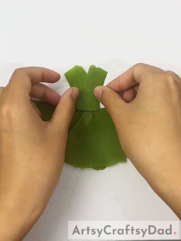 Pasting Top Of Girl's Dress Using Glue- Designing A Stunning Leaf Dress For Little Girls