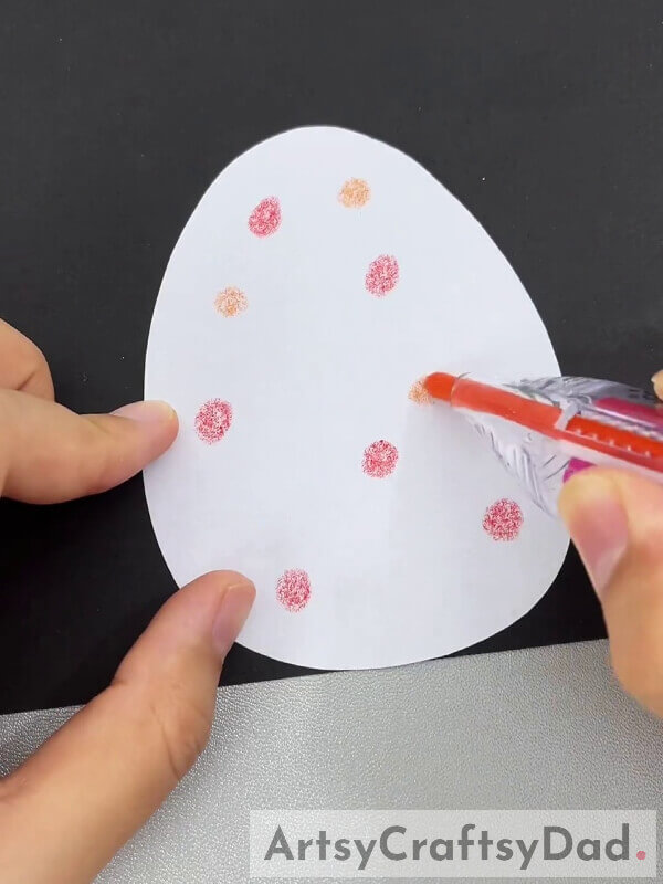 Putting Color Dots On Our Paper Eggs- Instructional Guide On Crafting a Chick Hatch Paper Craft With Children 