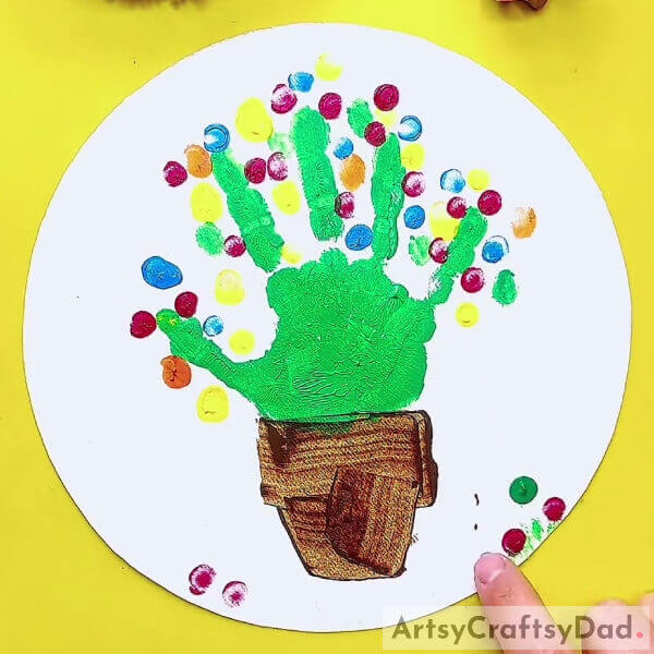 Putting Red Color Dots- A Guide to Making a Handprint Cactus Picture for Novices