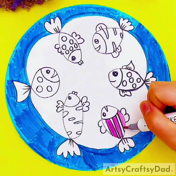 Taking A Pink Colored Sketch Pen And Start Coloring A Fish Now-Fish Assembly: Pen Sketch Tutorial