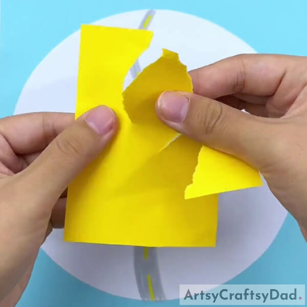 Tearing Yellow Color Craft Paper To Create A Tree-Creating a paper tearing art in the woods: a tutorial.