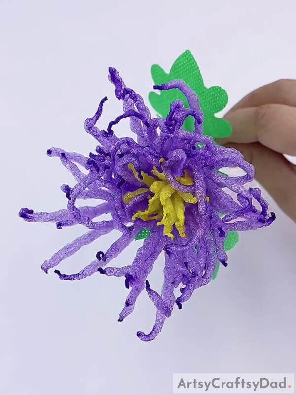 Add more leaves if you like - How to decorate a craft project using foam and purple fruits 