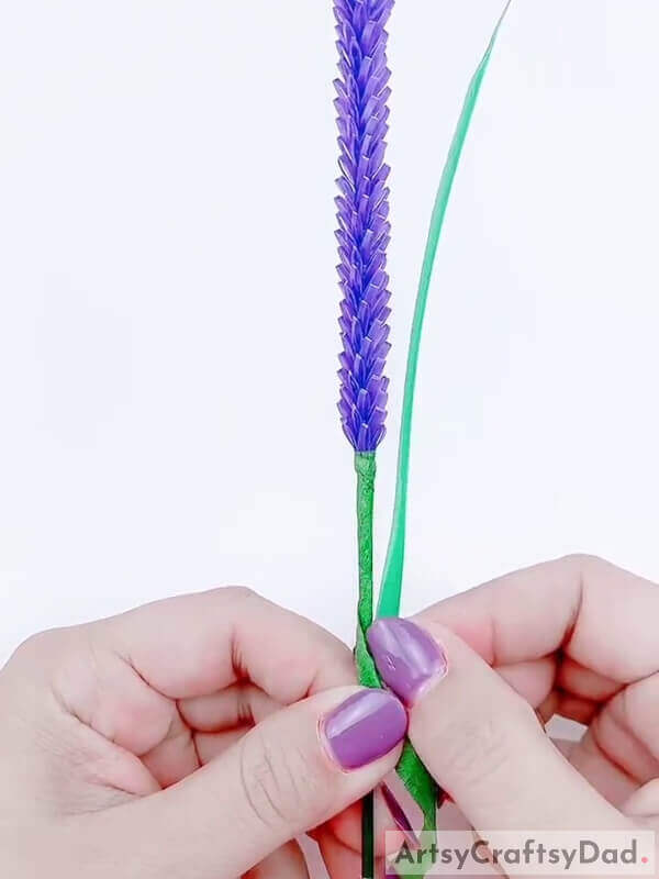 Add the light green colored straw to get the leaf - Learn the Art of Creating a Plastic Straw and Lavender Blossom