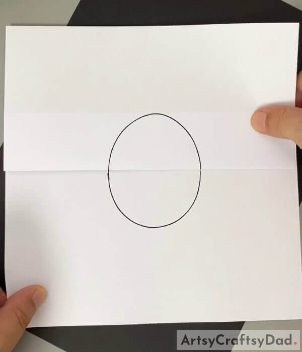 Draw an oval, outlining the cello tape - How to Draw a Hatching Chicken: A Fun Activity