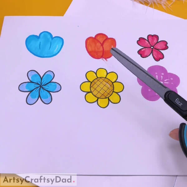 Draw and color some flowers on a white sheet of paper - Step-by-step guide for making paper flower gardens with kids