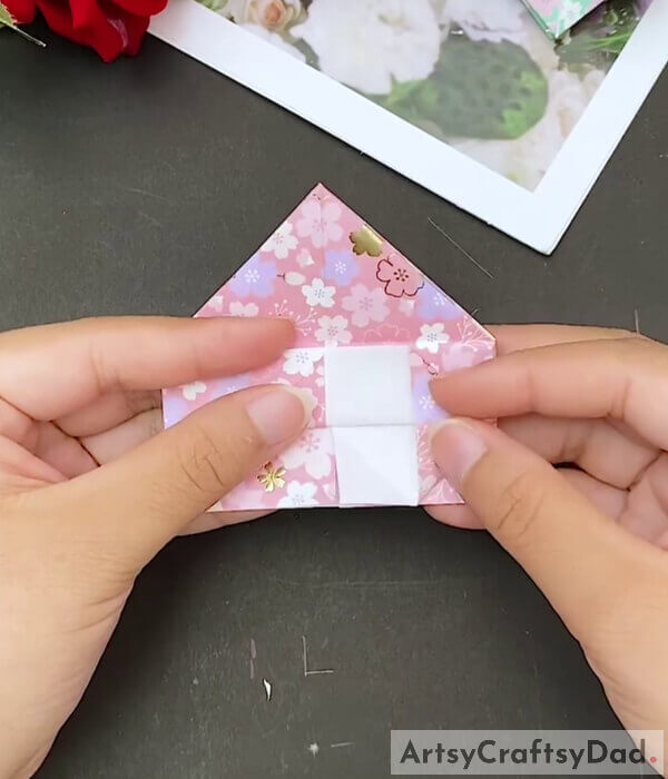 Fold One Section Up - This tutorial will help kids learn how to construct a paper heart from origami paper