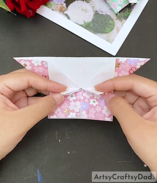 Fold The Bottom Left Corner - This tutorial explains how to craft a paper heart with origami paper for kids 