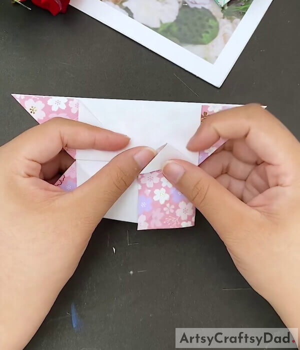 Fold The Bottom Right Corner - This tutorial is designed to teach kids to make a paper heart using origami paper 