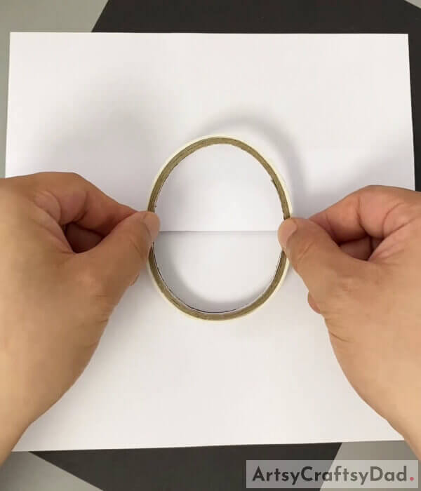 Fold a side of a sheet and place a cello tape - Tutorial on Drawing a Chick Hatching as a Fun Craft