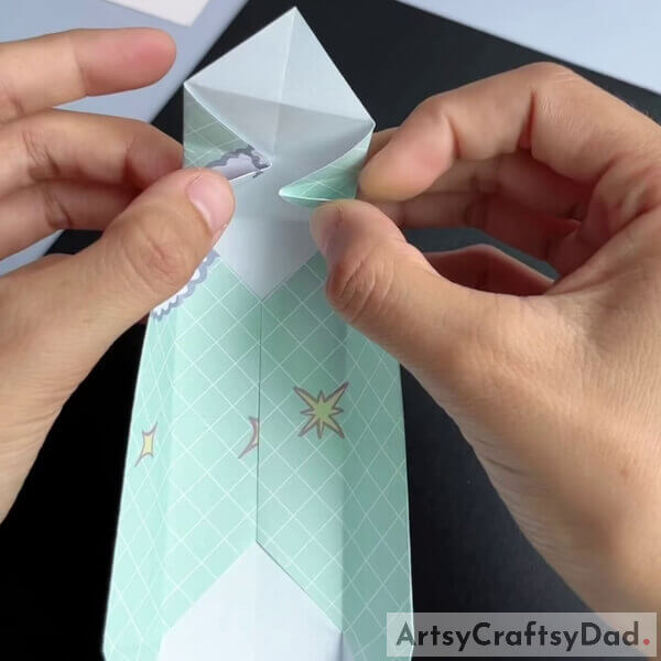 Fold the sides and the front partially - Walk-through for children to make a paper origami couch