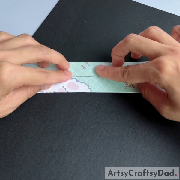 Fold them inwards where they meet at the center line - How to make a paper origami couch for kids