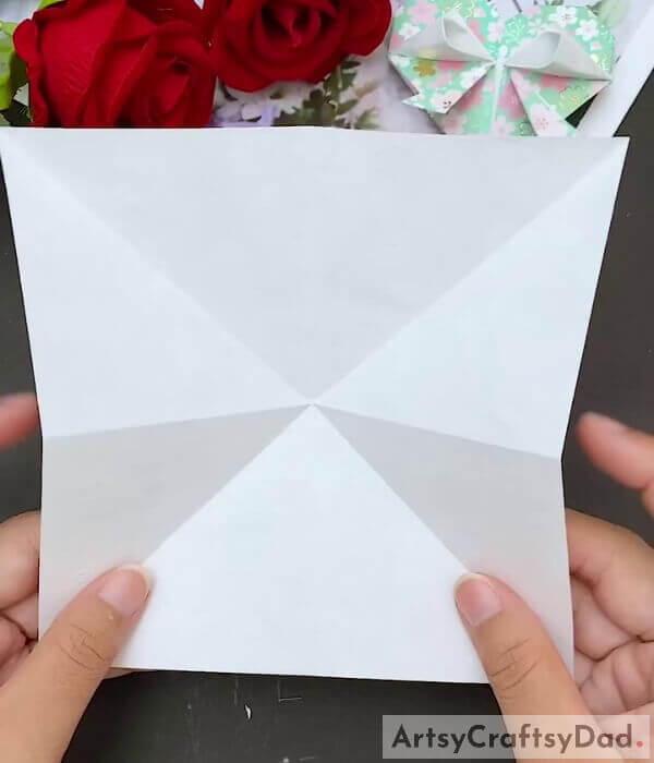 Form the Creases - This tutorial teaches children how to make a paper heart out of origami paper