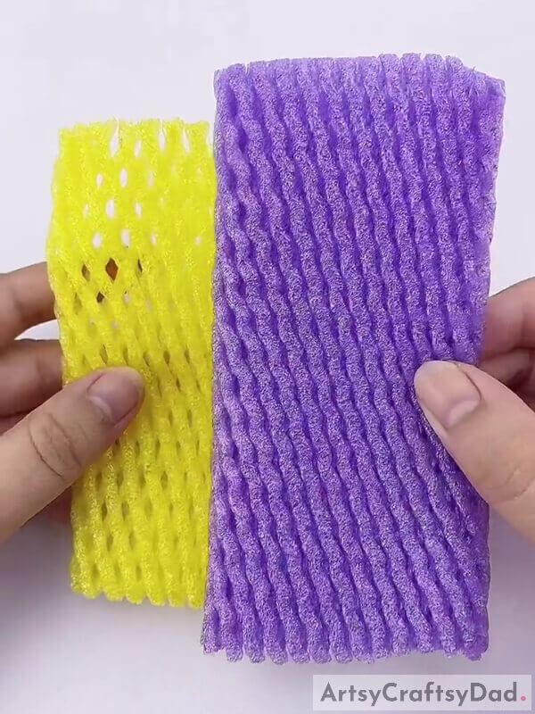 Get two fruit foams. One yellow and one purple - Crafting a Decoration with Foam and Netting Featuring Purple Fruits