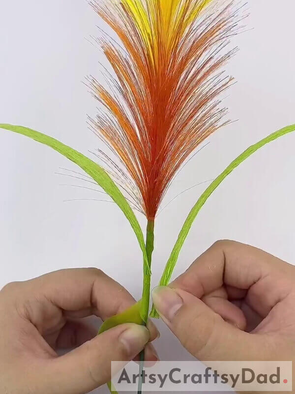 Green Ribbon - Learn How to Make a Yellow-Orange Pampas Grass Decoration with Ribbon with This Tutorial 