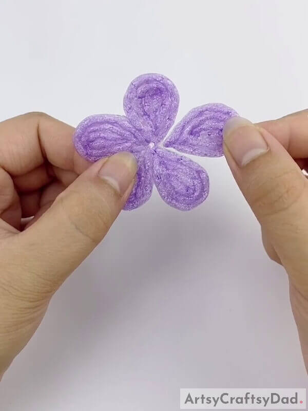 Make a flower out of the strings - Step by Step Guide to Making a Diamond Flower Wreath With a Fruit Foam Net and a Stick