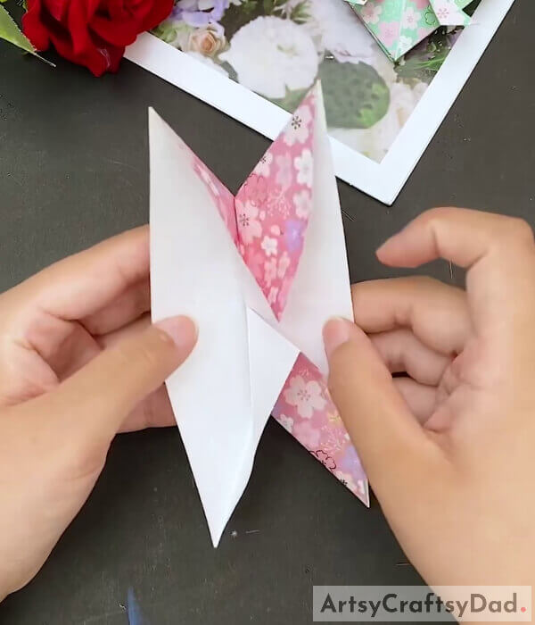 Open The Corner - This tutorial is designed to help kids make a paper heart out of origami paper