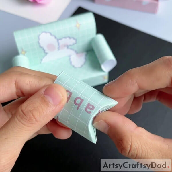 Open it and apply to push the fold inwards to get the puffiness - Learn the steps of crafting a paper sofa with this origami tutorial specifically designed for kids