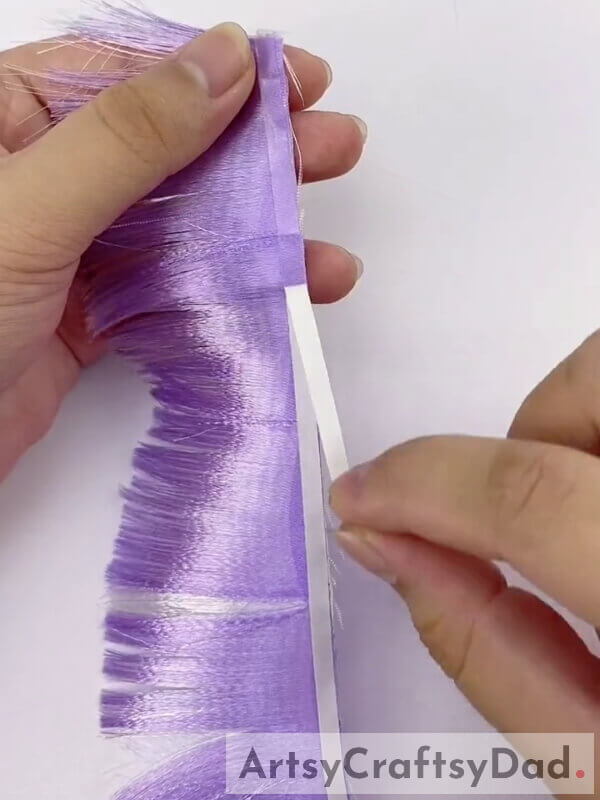 Peel out the Paper covering the Tape - Crafting a Purple Ribbon Pampas decoration - instructions included