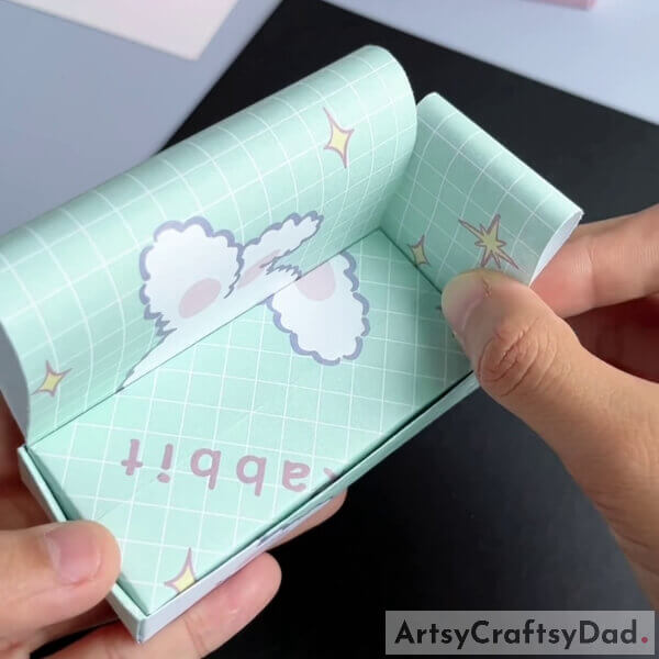 Place it in the box in the following manner - Kids can make a Paper Origami Couch with this tutorial