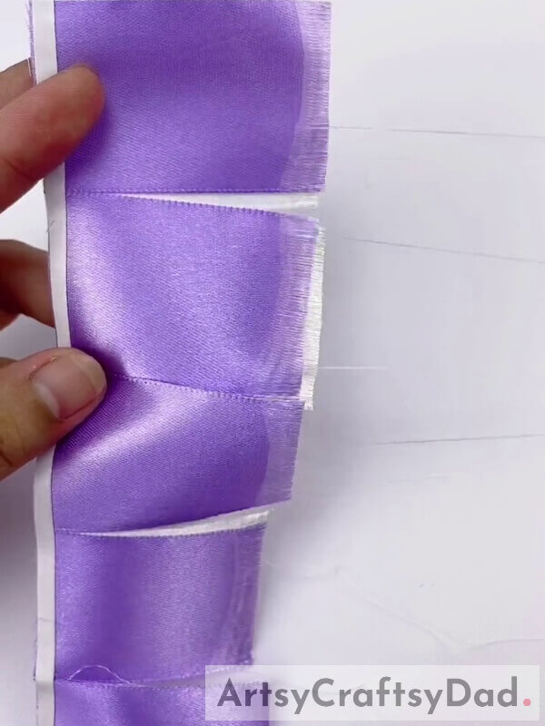 Pull Out the Ribbon Threads to make it Fringed - Making decorations using purple ribbon and pampas - a step-by-step guide