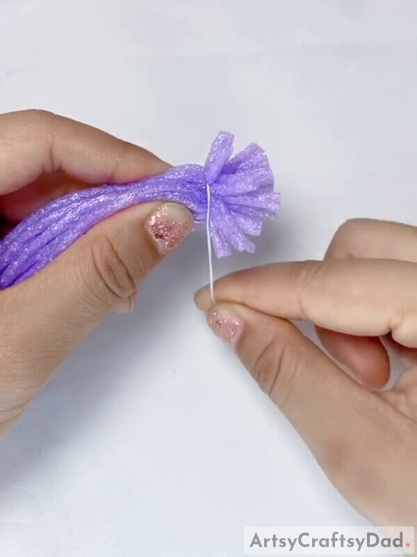 Roll and Tie - Step-by-Step Directions for Constructing a Fruit Foam Net with Lavender Fake Flowers 