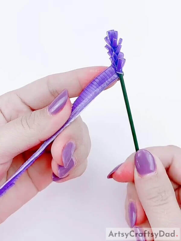 Start to wrap the plastic straw around the stick - Step-by-Step Guide on Constructing a Plastic Straw and Lavender Bloom