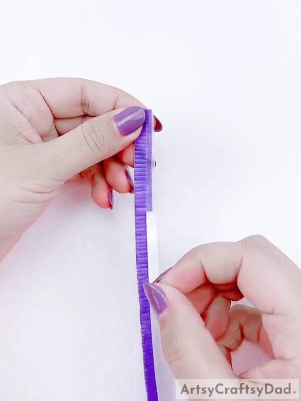 Stick a thin double-sided tape on the uncut area - Learn to Assemble a Plastic Straw and Lavender Blossom