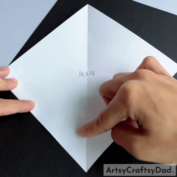 Take an origami paper of dimensions 14x14 - Tutorial for kids on how to make a paper origami couch