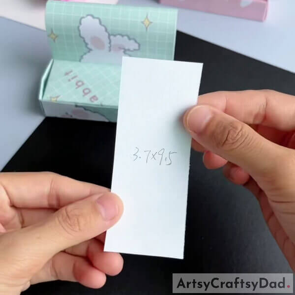 Take another origami sheet of dimensions 3.7x9.5 - This tutorial helps kids create a Paper Origami Sofa