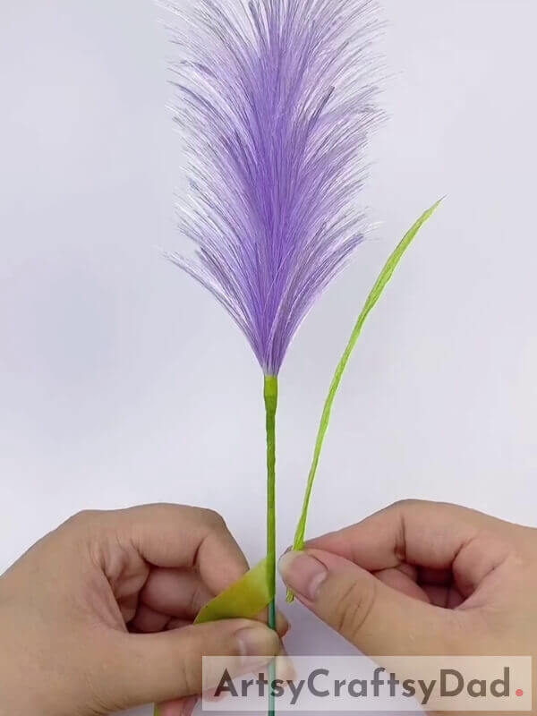 Tape the Leaves onto the Stem - Tutorial on Crafting Purple Ribbon Decorations 