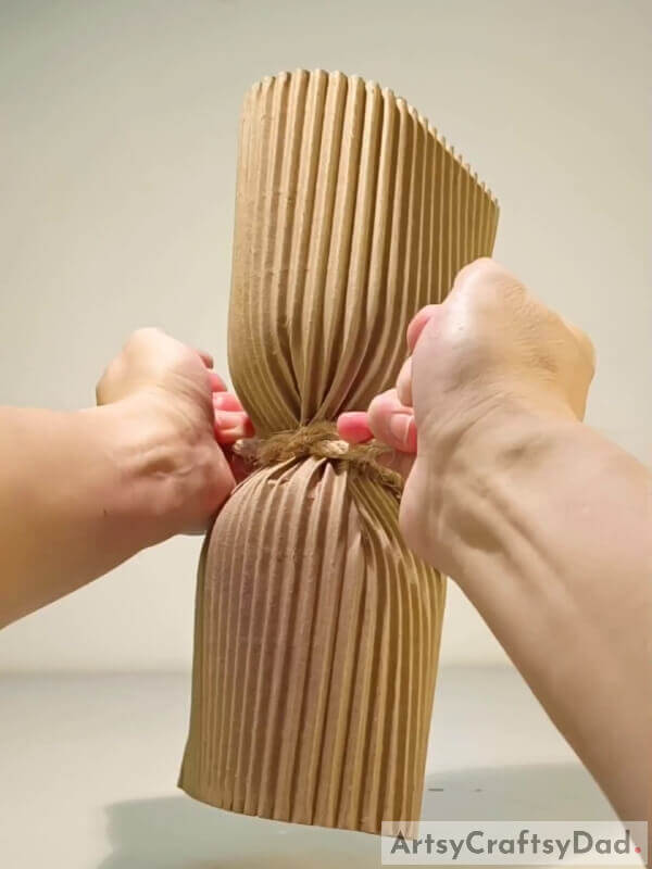 Tighten the rope just a little bit - Tutorial on How to Assemble a One-of-a-Kind Cardboard Flower Vase for Little Ones