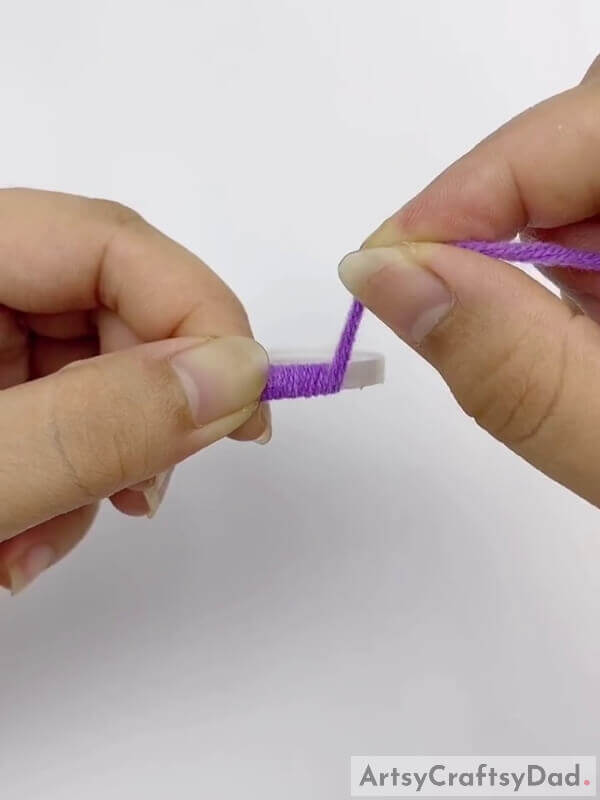 Wrap a purple thread around the lid - Step-by-Step Instructions for Creating a Diamond Flower Wreath with Fruit and Sticks