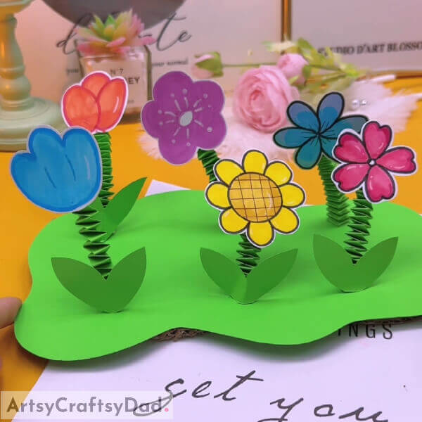 Final Image: Here it is! The final look of the garden - Teach children to create a paper flower garden