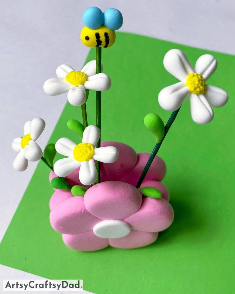 Adorable Clay Flower and Bee Craft In Vase Cute Clay Blossom and Insect Artwork In Container
