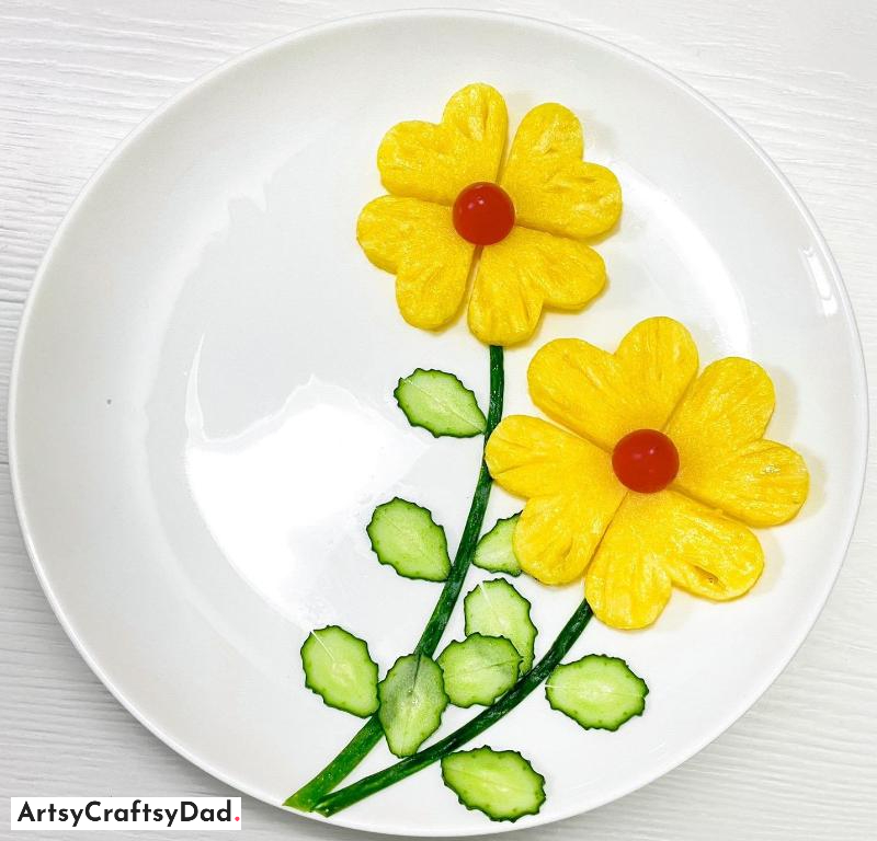 Amazing Flower Food Plate Decoration Using Pineapple and Cucumber Carving - An incredible flower-shaped dish adorned with pineapple and cucumber carving