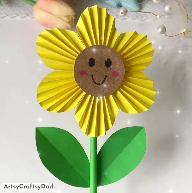 Beautiful Paper Yellow Flower Craft for Kids - Parents and their offspring constructing paper flowers