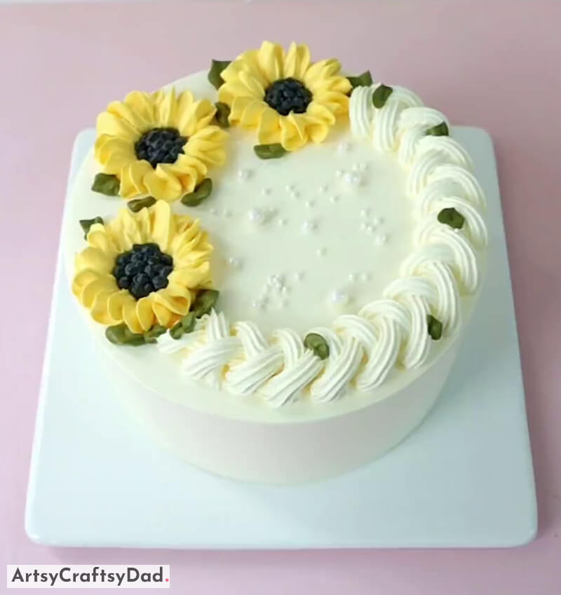 Bright Yellow Sunflower Decoration Idea on White Cake - Strategies for Enhancing a Sunflower Cake