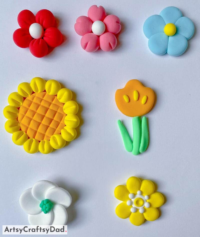 Cute Small Flowers Craft Idea Using Colorful Clay Creating a delightful craft with miniature blossoms utilizing vibrant clay.