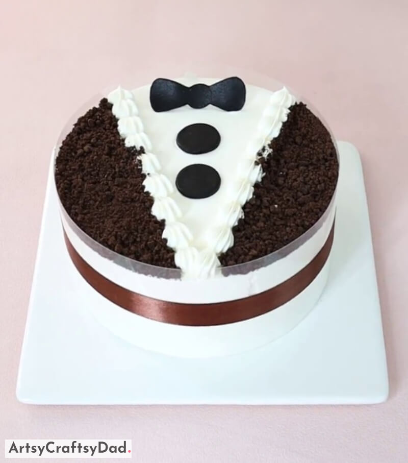 Decorating a Chocolate Tuxedo Cake With a Bow - Enchanting Theme Linked Cake Decoration Suggestions For Special Occasions